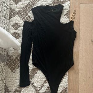 Super down black cutout body suit with gold chain shoulder